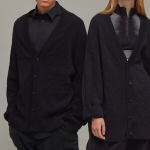 A Y-3 CARDIGAN WITH ASYMMETRICAL KNIT PATTERNS.